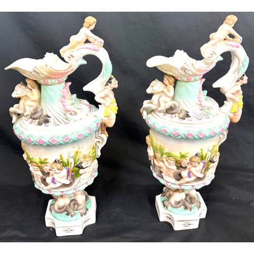 69 - Pair Christian Nonne style Volkstedt porcelain ewer / pitcher, both have been repaired to spout, ove... 