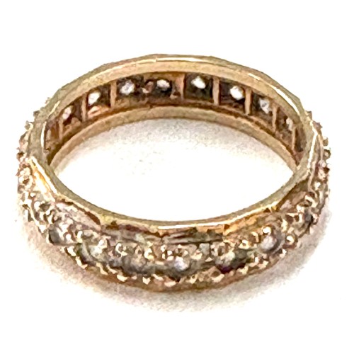 537 - Ladies 9ct gold stone set ladies full eternity ring, approximate weight 3g, ring size M