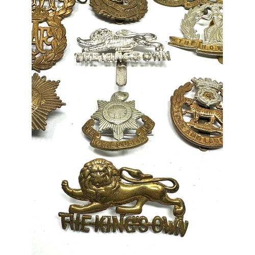 379 - 10 military cap badges inc kings own york & lancs etc