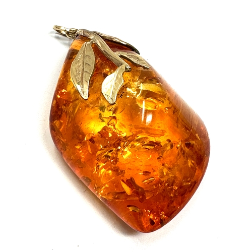 101 - Large 9ct gold mounted Amber pendant measures approx 6cm drop weight 23.8g xrt tested as 9ct gold