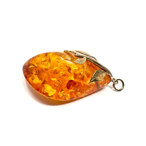 101 - Large 9ct gold mounted Amber pendant measures approx 6cm drop weight 23.8g xrt tested as 9ct gold