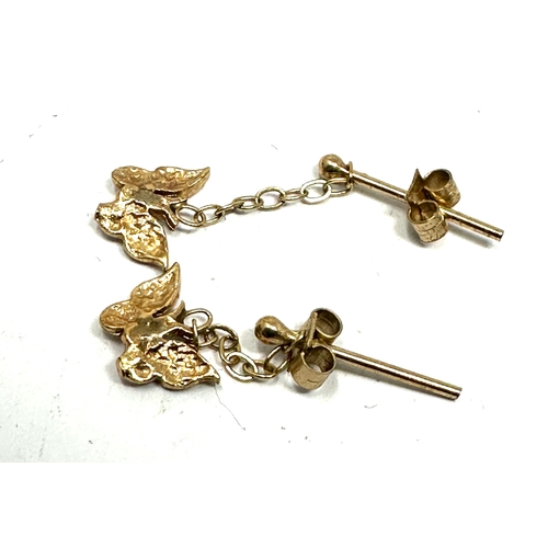 105 - 9ct gold butterfly earrings measure approx 2 cm drop weight .8 gram