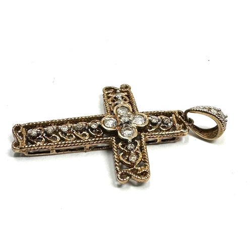 108 - 9ct gold diamond cross measures approx 3.5cm drop set with 18 diamonds weight 2.4g