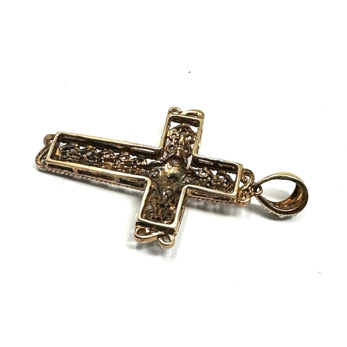 108 - 9ct gold diamond cross measures approx 3.5cm drop set with 18 diamonds weight 2.4g