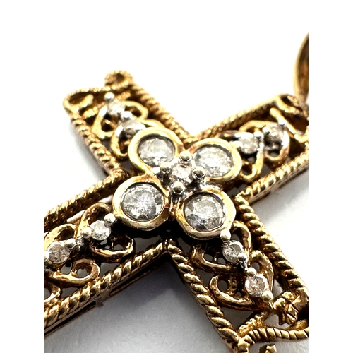 108 - 9ct gold diamond cross measures approx 3.5cm drop set with 18 diamonds weight 2.4g