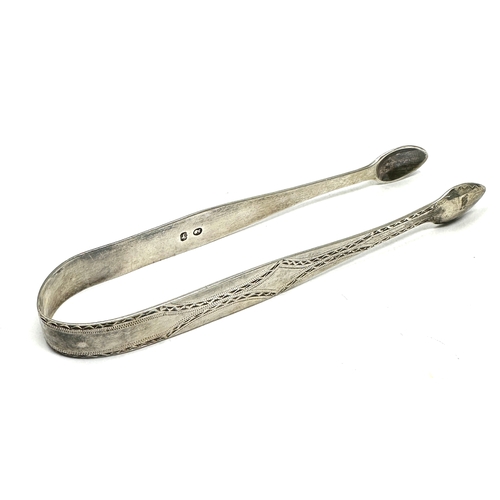 31 - Antique georgian bright cut silver sugar tongs