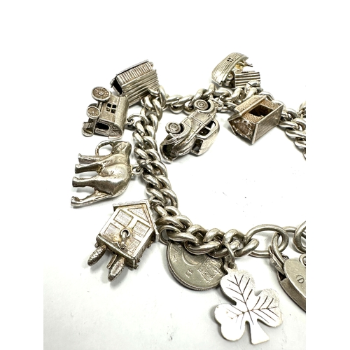 275 - Vintage silver charm bracelet inc opening charms weight 71g