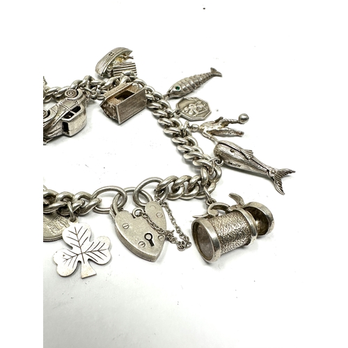 275 - Vintage silver charm bracelet inc opening charms weight 71g