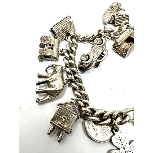 275 - Vintage silver charm bracelet inc opening charms weight 71g