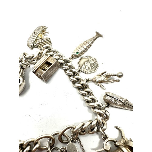 275 - Vintage silver charm bracelet inc opening charms weight 71g