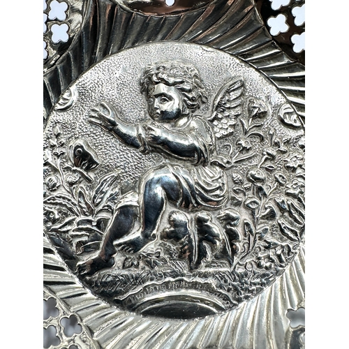 49 - Antique silver cherub embossed sweet dish measures approx 11.5cm dia