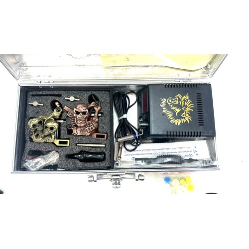 13 - Cased tattoo gun and accessories - untested