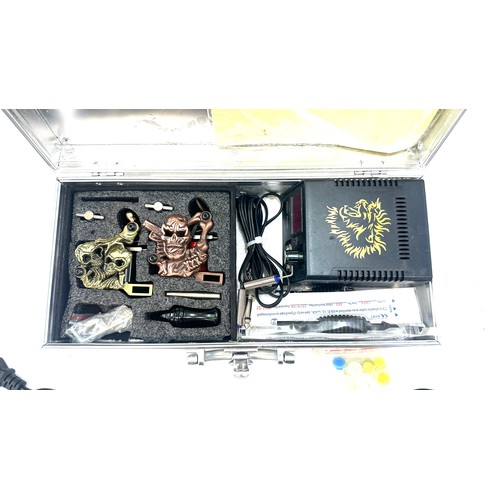 13 - Cased tattoo gun and accessories - untested