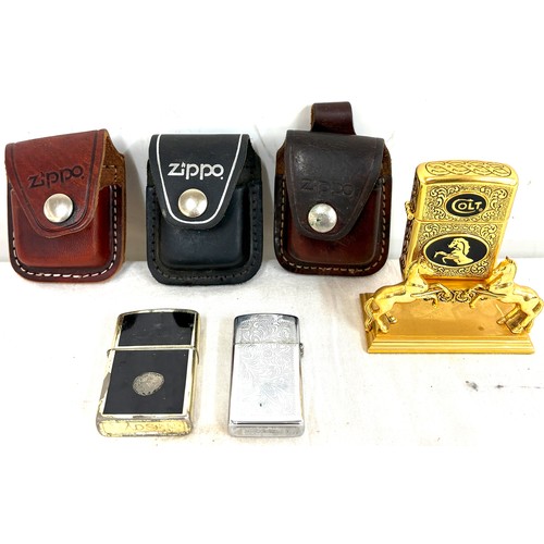 520 - Franklin Mint Colt lighter, Hanson, Zippo with 3 Zippo leather buckle cases