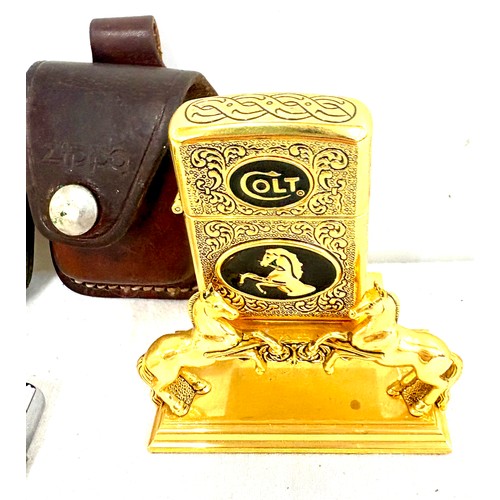 520 - Franklin Mint Colt lighter, Hanson, Zippo with 3 Zippo leather buckle cases