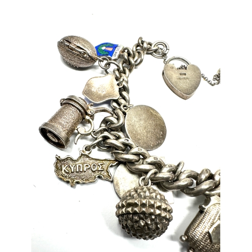 290 - Vintage silver charm bracelet inc opening charms weight 82g