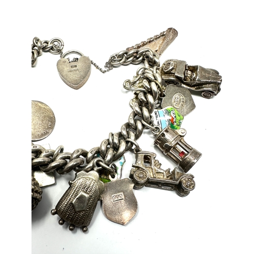 290 - Vintage silver charm bracelet inc opening charms weight 82g