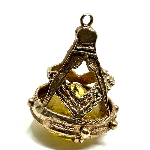 60 - 9ct gold yellow stone set masonic fob measures approx 2.7cm drop weight 9.2g