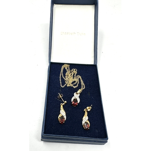 64 - 9ct gold garnet & diamond pendant necklace & earring set weight 3.4g in elizabeth duke box