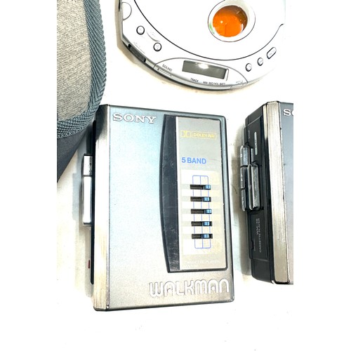 49A - Two vintage Sony Walkman VM-36 cassette player and a Sony walkman cd player model no D-E340 with an ... 