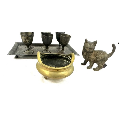 528 - Selection of collectable items to include a brass cat a sensor and a set of 6 brass goblets on a tra... 