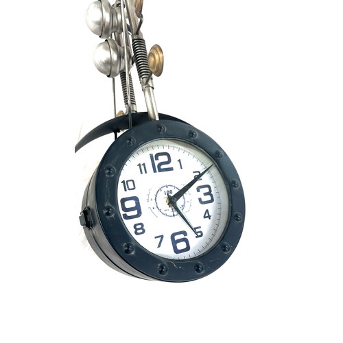 102 - Doubled faced motorbike style wall clock, approximate measurements: