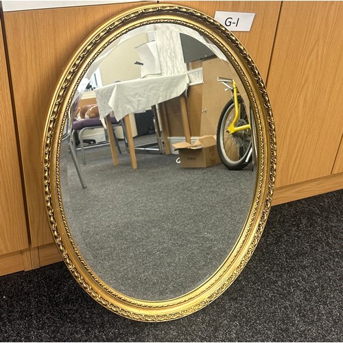 82 - Oval gilt framed wall hanging mirror 30 inches tall x 22 wide