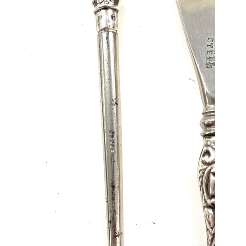 550 - Early pair of sterling silver sugar tongs and button hooks with silver handles and shoe horn