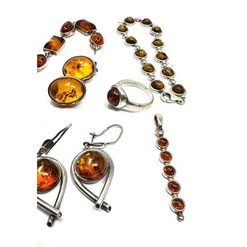 297 - Selection of silver & amber set jewellery includes bracelets earrings etc weight 35g