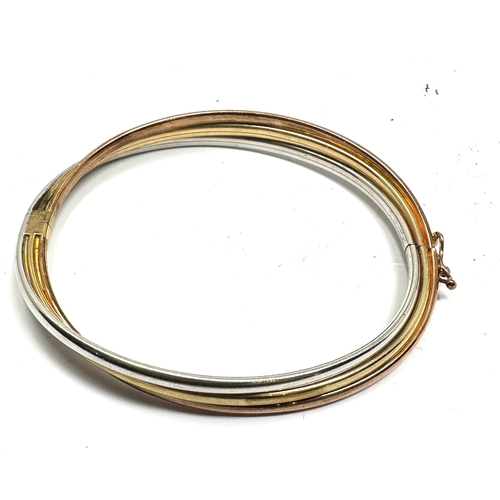 141 - 9ct gold three coloured gold bangle weight 8.9g