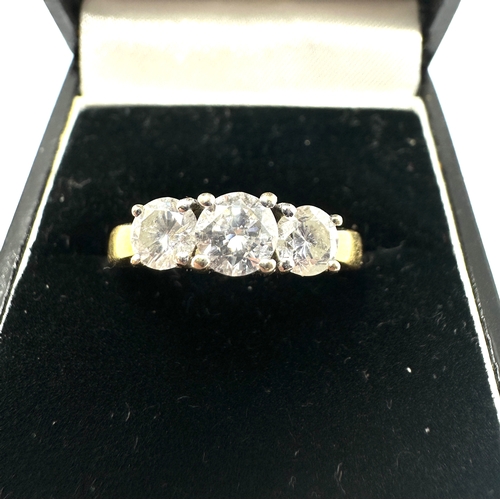 142 - 18ct gold diamond ring set with three diamonds the centre diamond measures approx 5mm with diamonds ... 