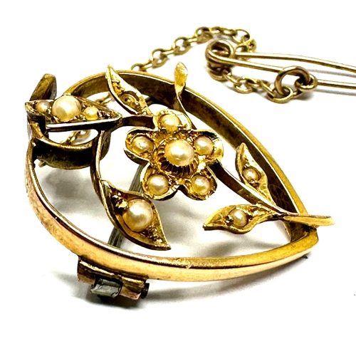 144 - Antique 15ct gold seed pearl brooch measures approx 2.4cm drop weight 3.7g missing seed pearl