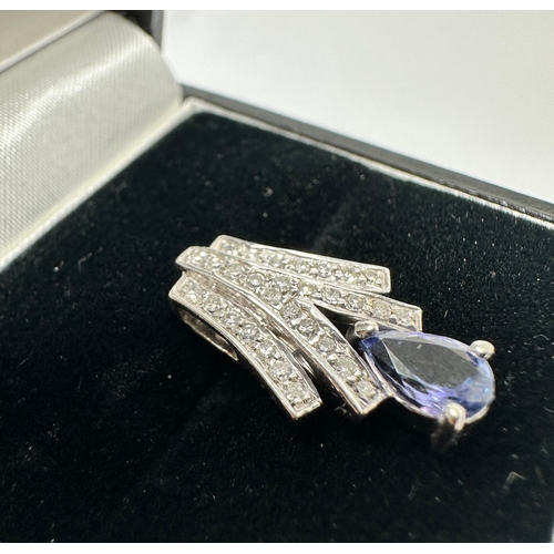 148 - 9ct white gold Diamond & Tanzanite pendant  measures approx 1.9cm drop weight 1.82g