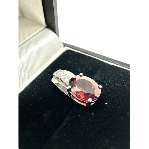 149 - 9ct white gold diamond & garnet pendant measures approx 1.5cm drop weight 1.45g