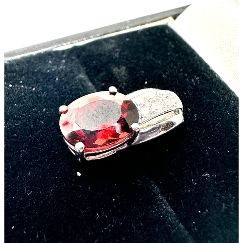 149 - 9ct white gold diamond & garnet pendant measures approx 1.5cm drop weight 1.45g