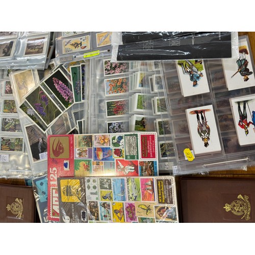 259 - Selection of assorted cigarette cards, stamps, folders etc