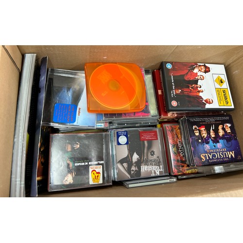 253 - Large selection of assorted DVDS and CDS to include various genres and artists