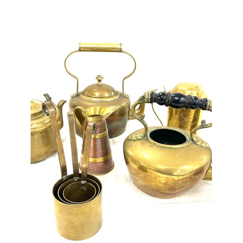 133A - Selection of brass kettles and jugs some copper