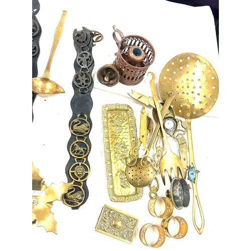 179 - Large selection of brass items to include napkin rings, salt shaker, candle holders etc