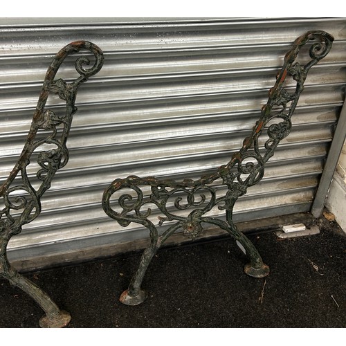 299 - Two victorian cast iron bench ends measures approximately 32 inches tall x 24 deep