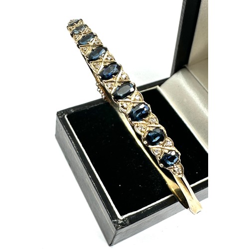 189 - 9ct gold sapphire & diamond bangle weight 8.4g