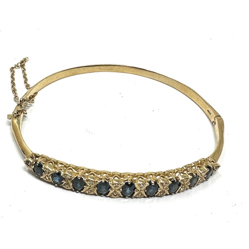 189 - 9ct gold sapphire & diamond bangle weight 8.4g