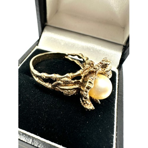 161 - 9ct gold floral design pearl ring weight 8.2g