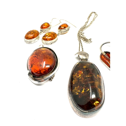 211 - selection of silver & amber jewellery includes pendant earrings etc weight 50g