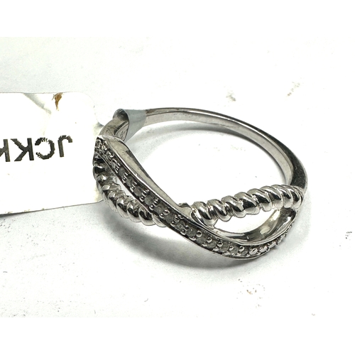 219 - Sterling silver & diamond ring