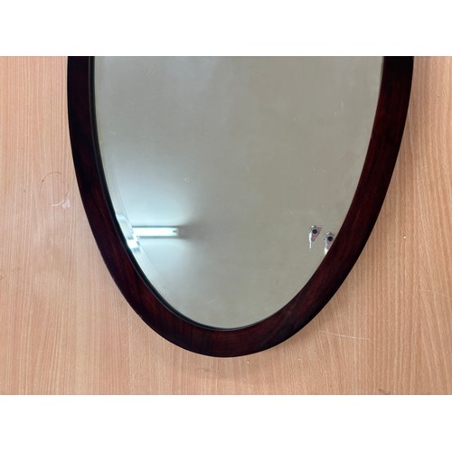 292A - Vintage oval mantle mirror measures approximately 32 inches by 18 inches