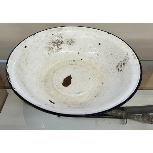 285 - Large enamel bowl measures approximately 18 inches diameter