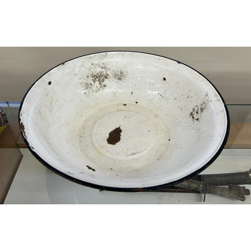 285 - Large enamel bowl measures approximately 18 inches diameter