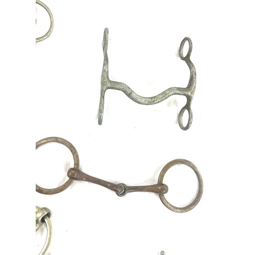 61 - Selection of metal horse bites and two foot rests