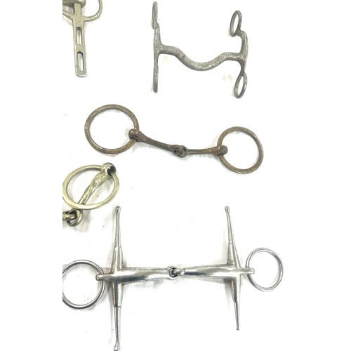 61 - Selection of metal horse bites and two foot rests